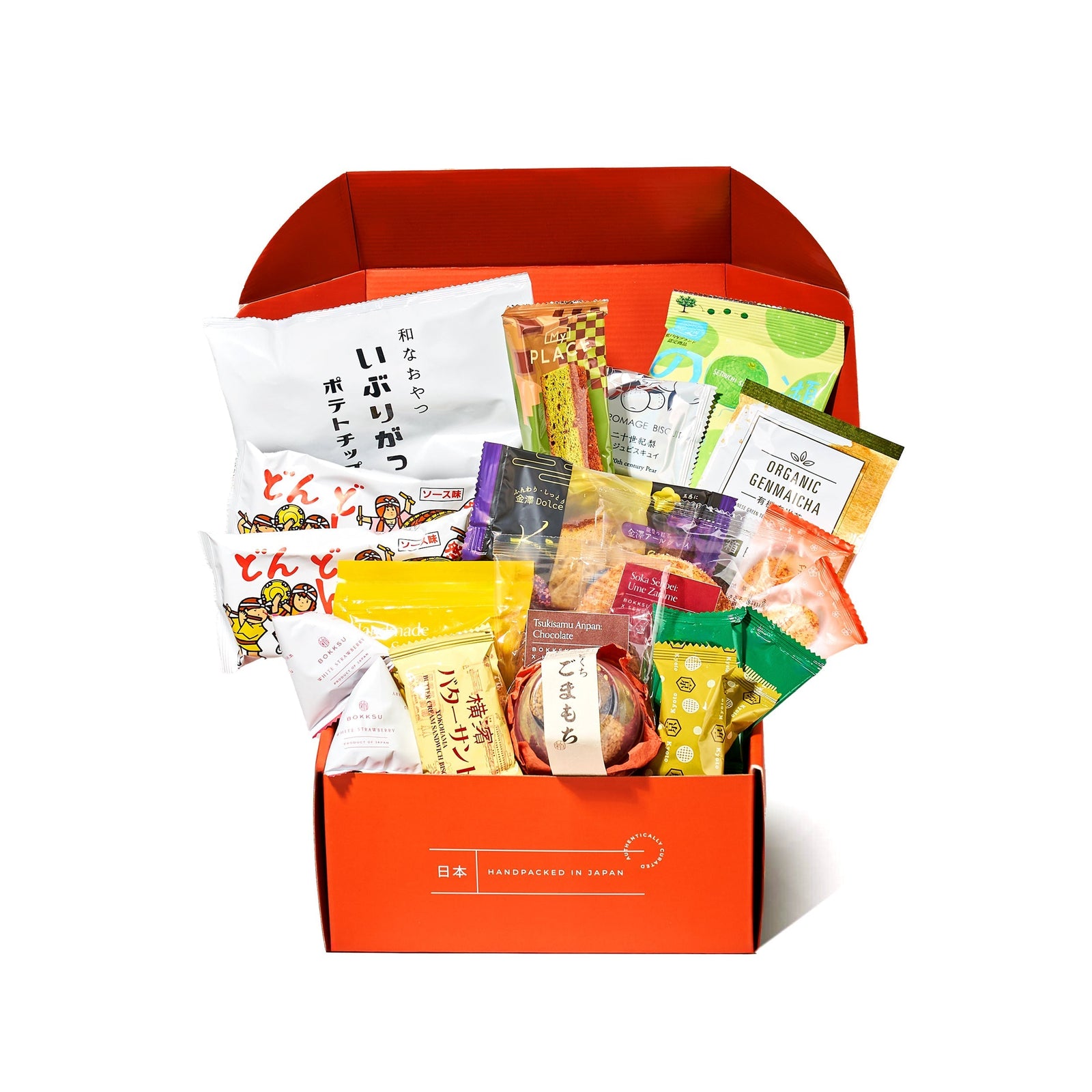 An open Bokksu Snack Box: Seasons of Japan is filled with assorted Japanese snacks in colorful packages, displayed upright against a white background.